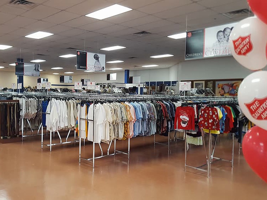 racks of clothes at Our Family Thrift Store